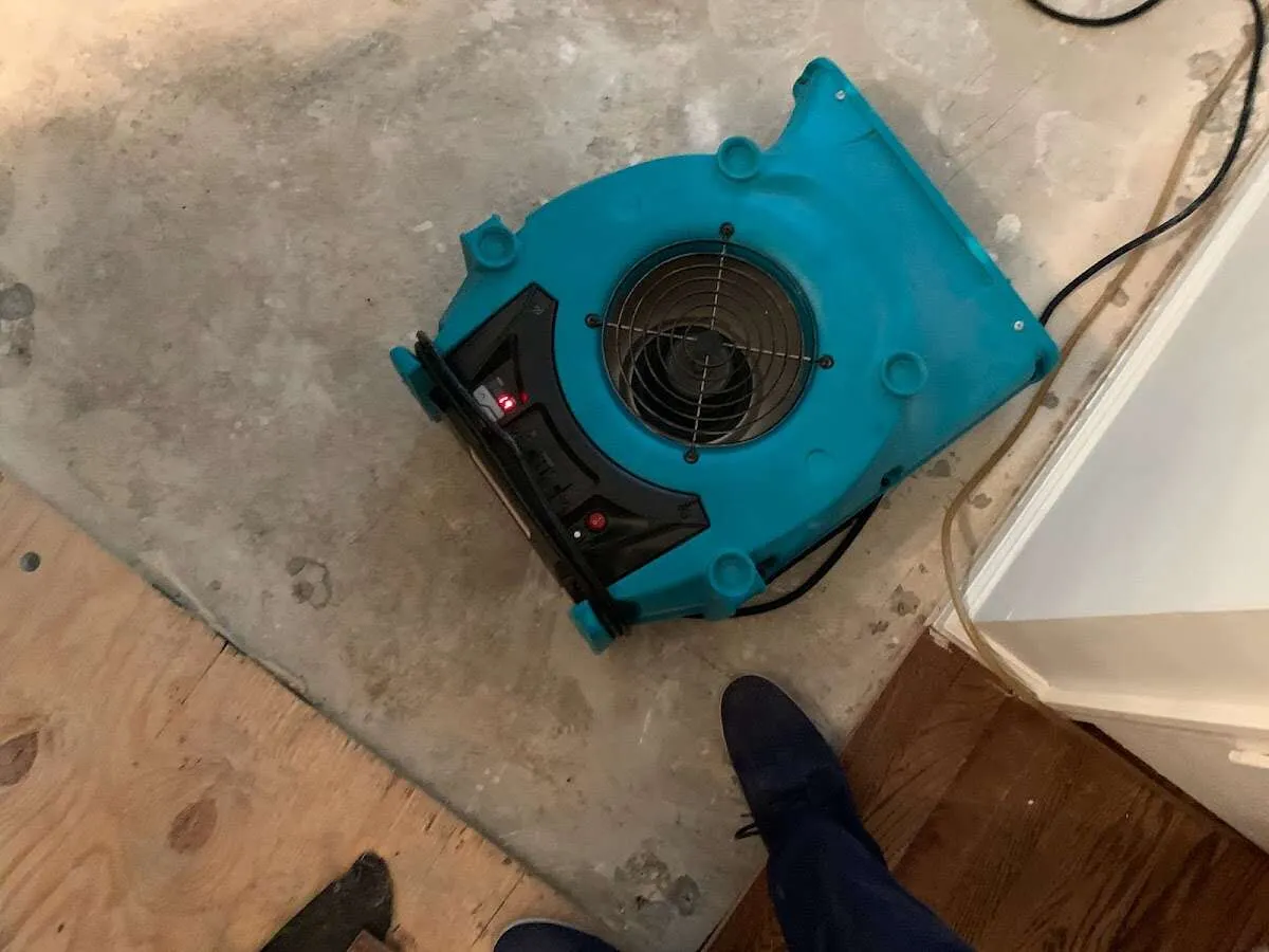 Air mover drying subfloor during Leak Detection & Repair in Broomfield